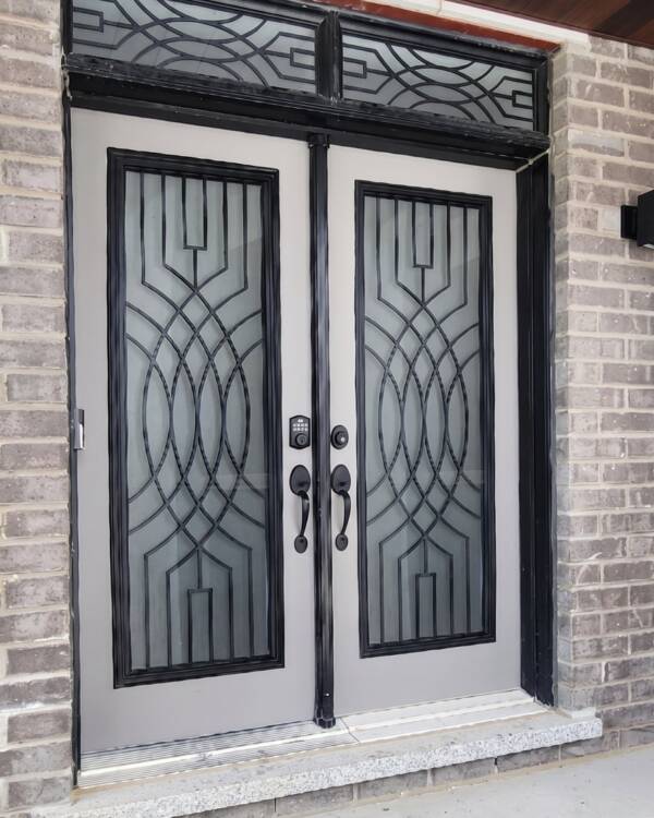 Graezen wrought iron inserts in a double door with a transom