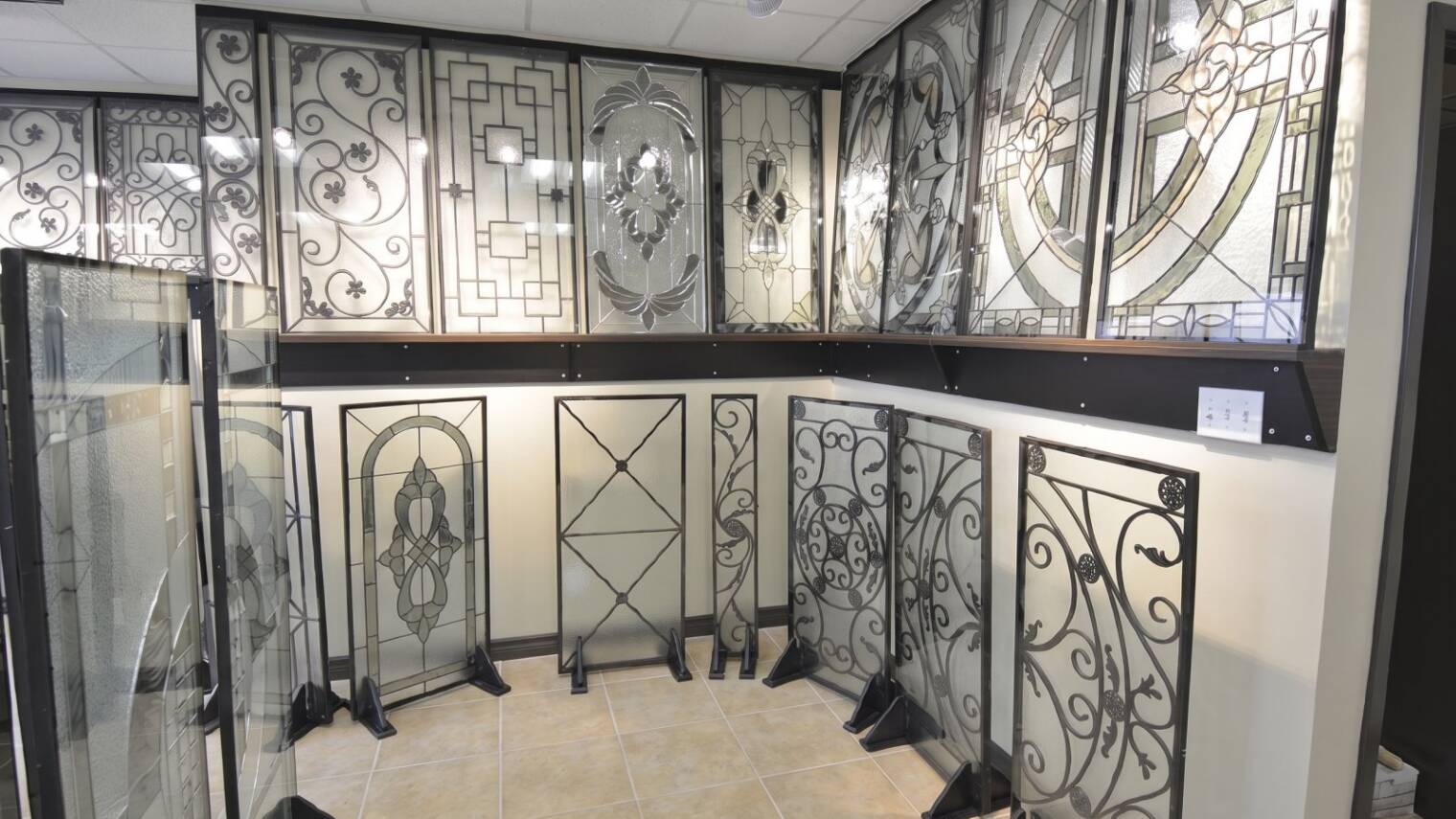 Wrought iron and stained glass inserts on display in the showroom