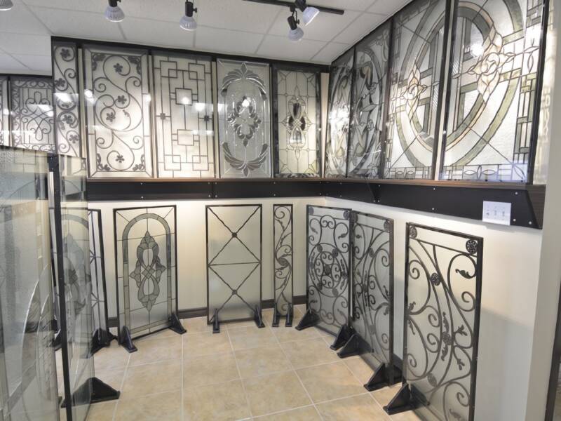 Wrought iron and stained glass inserts on display in the showroom