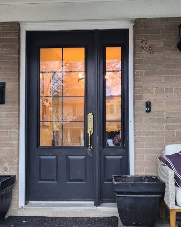 A Vibe insert with clear glass in a black front door