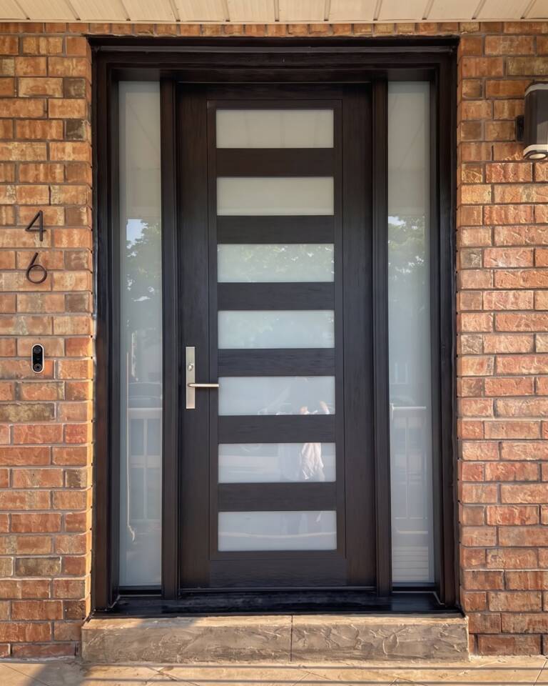 A black modern exterior door with horizontal glass lites