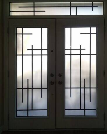 Enigma wrought iron door insert, installed (photo 2)