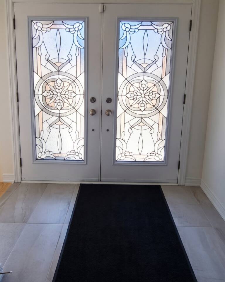 Eternity stained glass inserts in a double front door