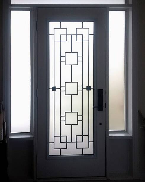 Artisan wrought iron door insert, installed (photo 7)