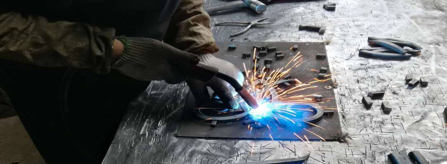 The parts of an iron insert being welded