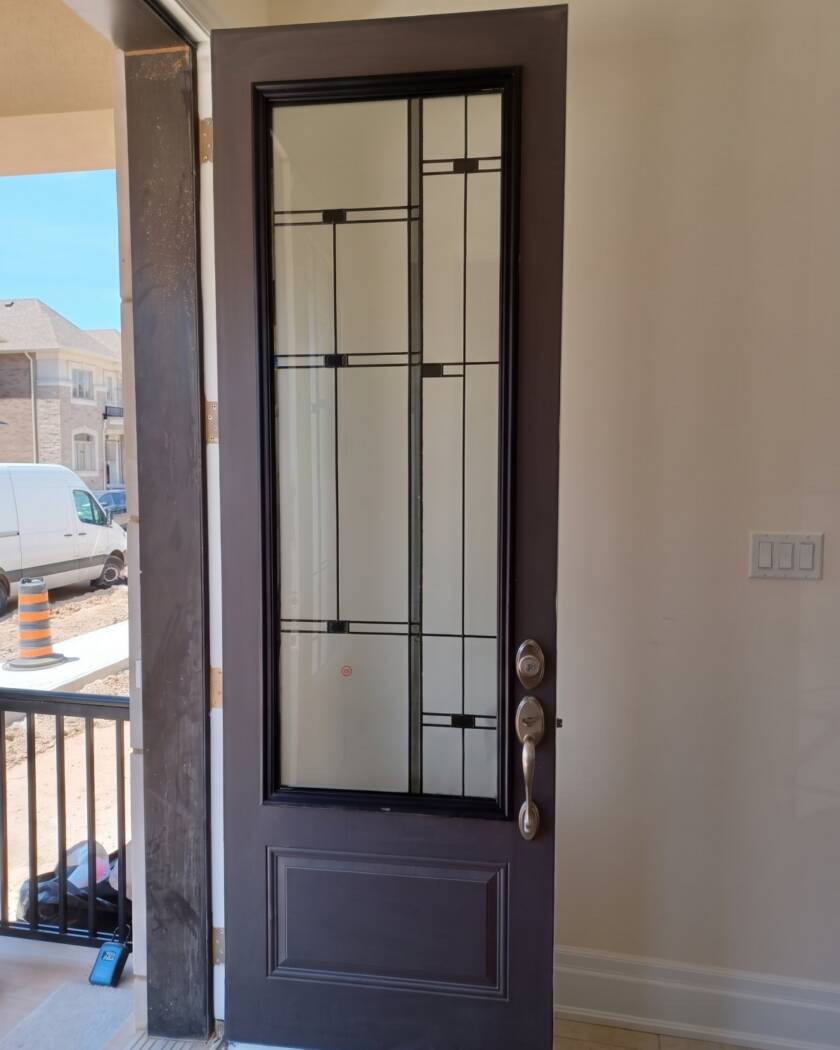 Nuance stained glass insert in a dark wood front door
