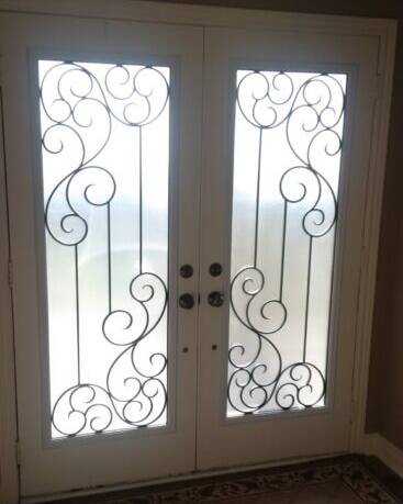 Odyssey wrought iron door insert, installed (photo 7)