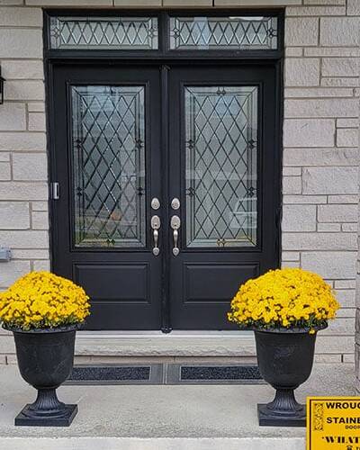 Prisma stained glass inserts in a double front door