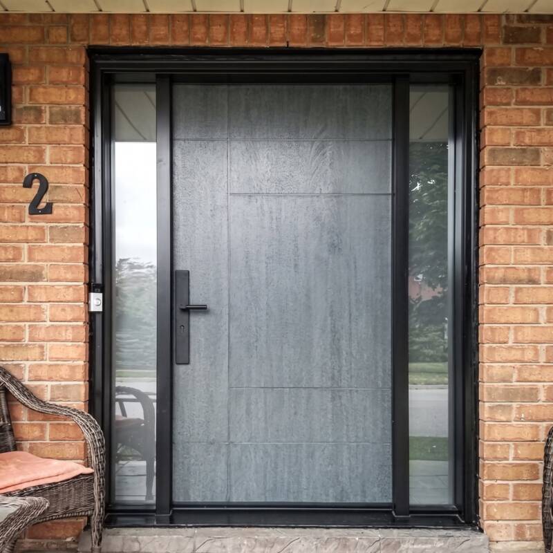 A grey woodgrain door with frosted sidelites