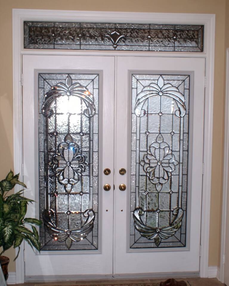 Krystal stained glass inserts in a white double door