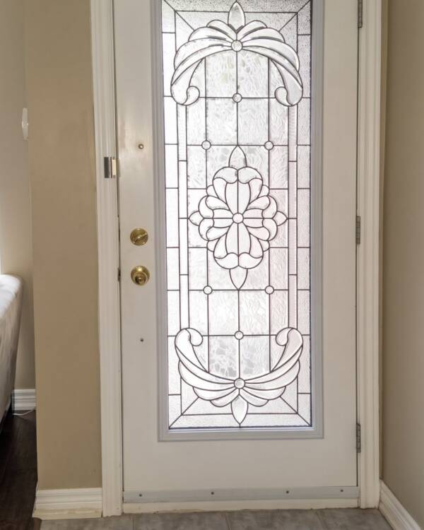 A Krystal stained glass insert in a single door