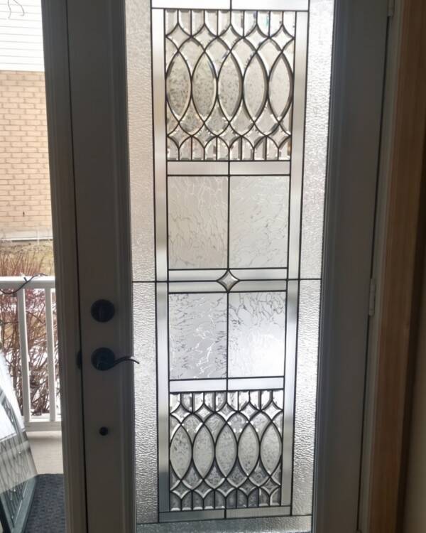 A Legacy stained glass insert in a single door